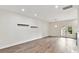 Bright and airy living room featuring hardwood floors, neutral walls, and natural light at 240 Faust Rd, Davidson, NC 28036
