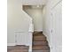 Interior shot of modern staircase with hardwood steps and white risers at 240 Faust Rd, Davidson, NC 28036