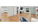 View of the finished basement featuring an open floor plan, wood-look flooring, and a bathroom at 3009 Brooks Mill Ln, Wingate, NC 28174