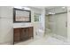 Bathroom with a modern sink, toilet and a glass-enclosed shower with decorative tile at 3009 Brooks Mill Ln, Wingate, NC 28174