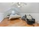 Bedroom with wood floors, natural light, and comfortable seating area at 3009 Brooks Mill Ln, Wingate, NC 28174