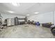 Functional garage space featuring ample storage with tool chests, workbench, and concrete flooring at 3009 Brooks Mill Ln, Wingate, NC 28174