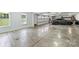 Clean garage interior with a gray car, ample space, and natural light from a large window at 3009 Brooks Mill Ln, Wingate, NC 28174