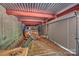 Storage garage featuring concrete walls, a metal ceiling, and a collection of machinery and equipment at 3009 Brooks Mill Ln, Wingate, NC 28174
