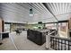 Covered outdoor patio with hot tub, ceiling fans, and comfortable seating for relaxation at 3009 Brooks Mill Ln, Wingate, NC 28174