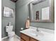 Cozy powder room with a framed mirror and neutral paint at 3030 Priory Ridge Dr, Fort Mill, SC 29707