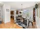 Open dining area with stylish decor, wood floors, and easy access to the kitchen and outdoor patio at 3030 Priory Ridge Dr, Fort Mill, SC 29707