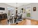 Cozy dining space with hardwood floors, decorative accents, and abundant natural light streaming through windows at 3030 Priory Ridge Dr, Fort Mill, SC 29707