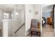 Upstairs hallway with chair, carpet, and views to the bedroom at 3030 Priory Ridge Dr, Fort Mill, SC 29707