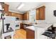 Charming kitchen featuring wood cabinets, a breakfast bar, and stainless steel appliances at 3030 Priory Ridge Dr, Fort Mill, SC 29707