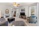 Spacious living room with large windows, stylish furniture, and a cozy, inviting atmosphere at 3030 Priory Ridge Dr, Fort Mill, SC 29707