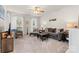 Bright living room featuring neutral carpet, ceiling fan, comfortable seating, and natural light at 3030 Priory Ridge Dr, Fort Mill, SC 29707