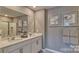 This elegant bathroom features dual sinks and a framed shower at 3068 Ora Smith Rd, Lincolnton, NC 28092