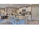 Modern kitchen island with granite countertops, seating, stainless steel appliances, and white cabinets at 3068 Ora Smith Rd, Lincolnton, NC 28092