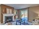 Cozy living room boasts a fireplace and is decorated with modern furnishings at 3068 Ora Smith Rd, Lincolnton, NC 28092
