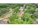 A clear aerial shot showcasing the property's boundaries and the surrounding wooded area at 3101 Hickory Hwy, Statesville, NC 28677