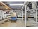 Unfinished basement featuring exposed wooden beams, support columns, and bare concrete floor at 3101 Hickory Hwy, Statesville, NC 28677