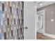 Bathroom featuring patterned shower curtain, tile flooring, and easy access to hall at 3101 Hickory Hwy, Statesville, NC 28677