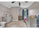 Well lit Bedroom with plush carpet, ceiling fan and room for storage and play at 3101 Hickory Hwy, Statesville, NC 28677