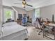 Spacious bedroom with two workstations, ceiling fan, lots of natural light and soft neutral carpet at 3101 Hickory Hwy, Statesville, NC 28677