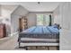 Comfortable bedroom with gray walls, a blue quilt, and ample natural light at 3101 Hickory Hwy, Statesville, NC 28677