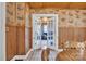 Charming dining room featuring wood paneling and a doorway leading to the living room at 3101 Hickory Hwy, Statesville, NC 28677