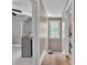 Hallway featuring hard wood flooring, easy access to bathroom and carpeted bedroom at 3101 Hickory Hwy, Statesville, NC 28677