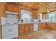 Bright kitchen with wood cabinets, lots of countertop space and matching wooden floors at 3101 Hickory Hwy, Statesville, NC 28677