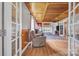 Open living room with hardwood floors, fireplace, and a comfortable armchair at 3101 Hickory Hwy, Statesville, NC 28677