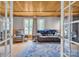 Comfortable living room boasts wood ceiling and large windows for ample natural light at 3101 Hickory Hwy, Statesville, NC 28677