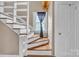 A staircase featuring distinctive woodwork, adding character to the home at 3101 Hickory Hwy, Statesville, NC 28677