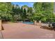 Spacious backyard with a well-maintained in-ground pool and gazebo surrounded by the yard at 3125 Arden Way, Claremont, NC 28610