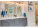 Bright bathroom featuring double vanity, modern lighting, and framed artwork at 3125 Arden Way, Claremont, NC 28610