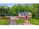Two-story home featuring a pool, fenced-in backyard, and circular driveway at 3125 Arden Way, Claremont, NC 28610