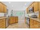 Bright kitchen featuring stainless steel appliances, tile floors, and shaker cabinets at 3125 Arden Way, Claremont, NC 28610