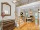 Open-concept living room with hardwood floors, fireplace, and staircase to upper level at 3125 Arden Way, Claremont, NC 28610