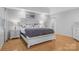 Spacious main bedroom with wood floors, a large bed, and neutral decor at 3125 Arden Way, Claremont, NC 28610