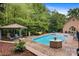 Enjoy a relaxing afternoon in the backyard by the pristine in-ground pool with gazebo at 3125 Arden Way, Claremont, NC 28610