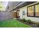 A tidy backyard features an artificial lawn, privacy fence, and a neat garden at 3538 Saker Ln, Charlotte, NC 28211