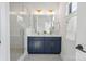 Modern bathroom features a double vanity, a glass-enclosed shower and white subway tile at 3538 Saker Ln, Charlotte, NC 28211
