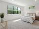 Bright bedroom with large windows and neutral tones at 3538 Saker Ln, Charlotte, NC 28211