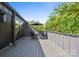 Outdoor deck area with table and chairs with view of trees at 3538 Saker Ln, Charlotte, NC 28211