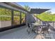 Relaxing outdoor deck featuring a dining table with umbrella and seating, surrounded by lush greenery at 3538 Saker Ln, Charlotte, NC 28211