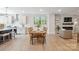 Bright dining area adjacent to the kitchen and living room, perfect for Gathering meals and entertaining guests at 3538 Saker Ln, Charlotte, NC 28211