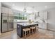 Stylish kitchen featuring stainless steel appliances, a center island with seating, and ample counter space at 3538 Saker Ln, Charlotte, NC 28211