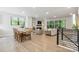 Open-concept living and dining area with large windows, hardwood floors, and modern finishes at 3538 Saker Ln, Charlotte, NC 28211