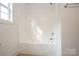 Bright bathroom features a white shower and tub combo with natural light at 4015 Amber Leigh Way Dr, Charlotte, NC 28269