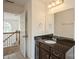 Bathroom features a dark granite vanity, tile floors, and a framed mirror at 4015 Amber Leigh Way Dr, Charlotte, NC 28269