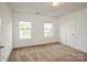 Carpeted bedroom with natural light features neutral colors at 4015 Amber Leigh Way Dr, Charlotte, NC 28269