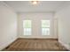Neutral bedroom featuring neutral carpet, windows with blinds, and crown molding details at 4015 Amber Leigh Way Dr, Charlotte, NC 28269